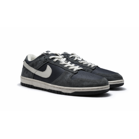 Grey low-top sneakers with white swoosh logo, lace-up design, and durable rubber sole